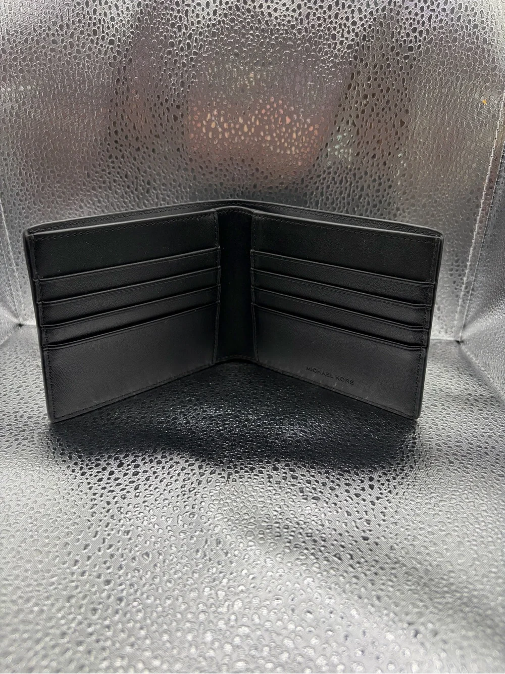 Michael Kors Black Textured Leather Bi-Fold Wallet with Gold Logo